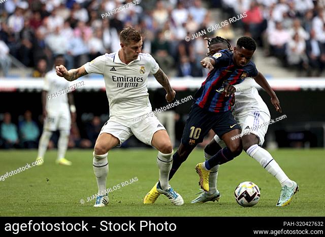 Madrid Spain; 10.16.2022.- Toni Kroos (L) and Ansu Fati (C) Real Madrid vs Barcelona match of the Spanish Football League on matchday 9 held at the Santiago...