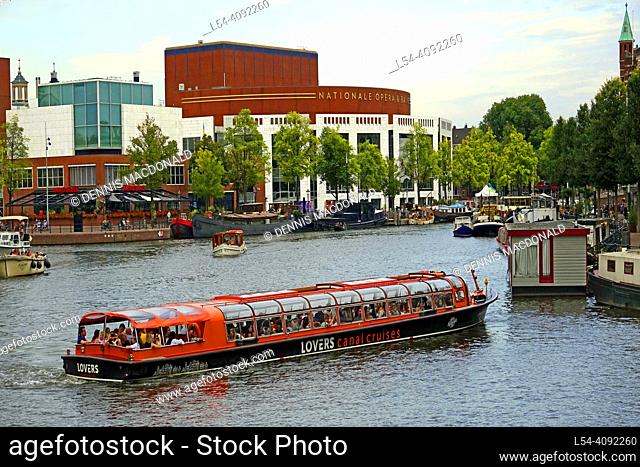 Canal cruise boaT Amsterdam Holland Netherlands city of beautiful buildings bicycles canals streets and bridges and night life