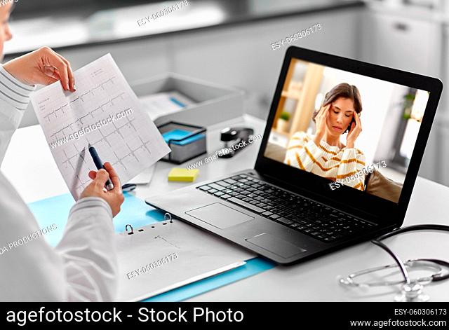 doctor having video call with patient on laptop