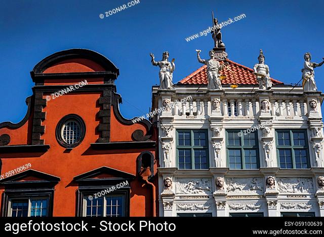 Top of old historic tenement houses with large sculptures and carvings at Long Market in Gdansk, Poland
