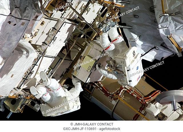 Astronauts Christopher Cassidy (right) and Tom Marshburn, mission specialists for STS-127, share duties on the fourth spacewalk of Endeavour's current mission...