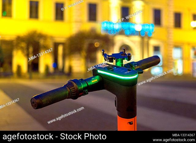 Parked e-scooter at night, Wittelsbacher Platz, Munich, Bavaria, Europe