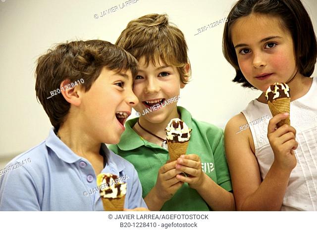 Children eating ice-cream cones, tasting session in sensory lab, AZTI-Tecnalia Marine and Food Research Center, Derio, Bizkaia, Euskadi, Spain
