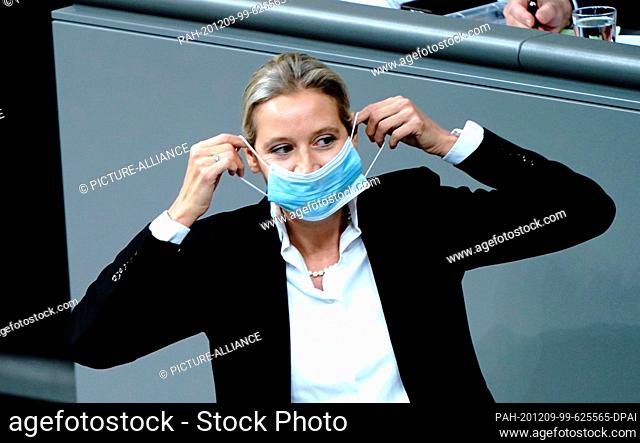 09 December 2020, Berlin: Alice Weidel, leader of the AfD parliamentary group, puts on her mouth and nose cover after her speech during the general debate on...