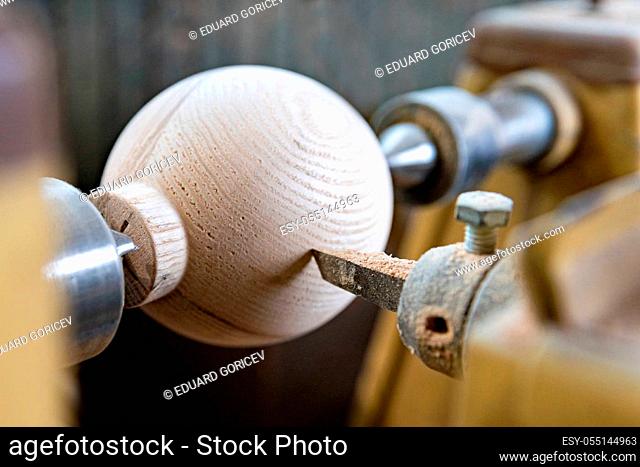 manufacture round wooden handles on lathe in joinery