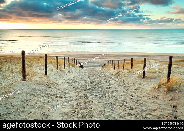 sand path to the North sea at sunset, Holland