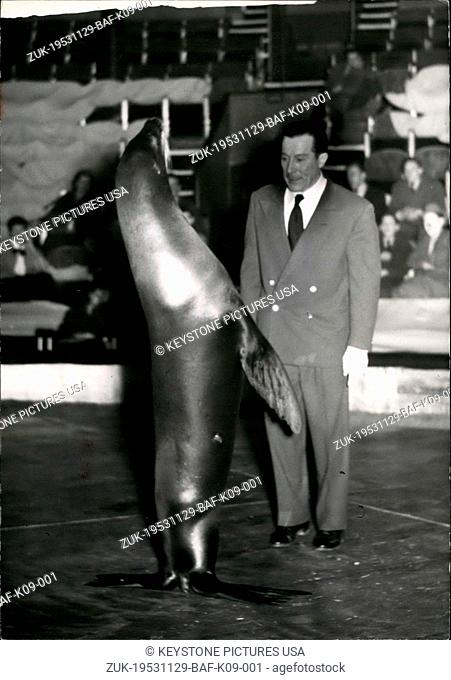 Nov. 29, 1953 - Medrano's latest attraction.: Armand Guerre, seal tamer, shows his latest attraction at the Medrano Circus, Paris