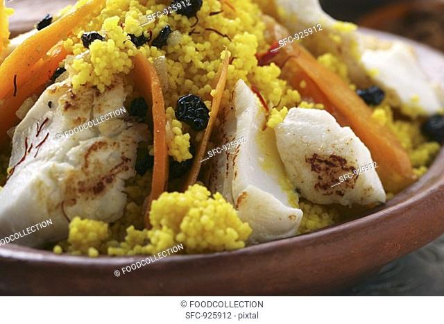 Saffron couscous with fish, carrots and raisins N Africa