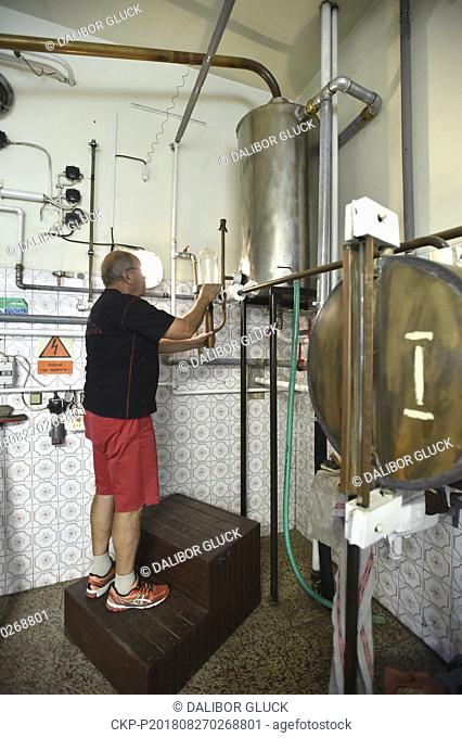 A grown distillery (production of fruit spirit for growers) employee Otto Fiser works on August 27, 2018, in Breznice, Zlin Region, Czech Republic