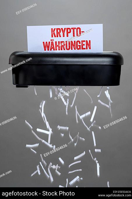 A shredder destroying a document - Cryptocurrencies - Kryptowaehrungen German