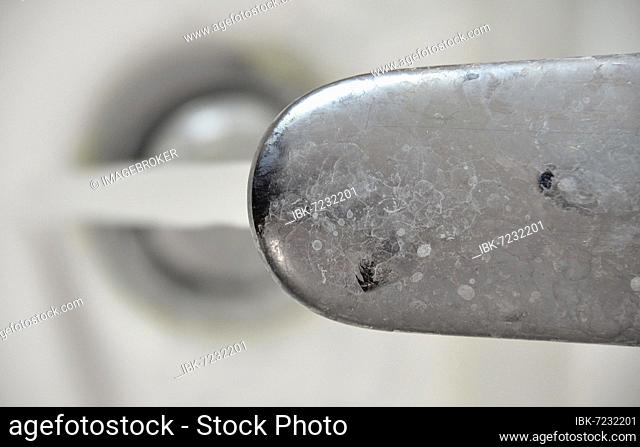 Calcified, dirty tap, chrome-plated surface