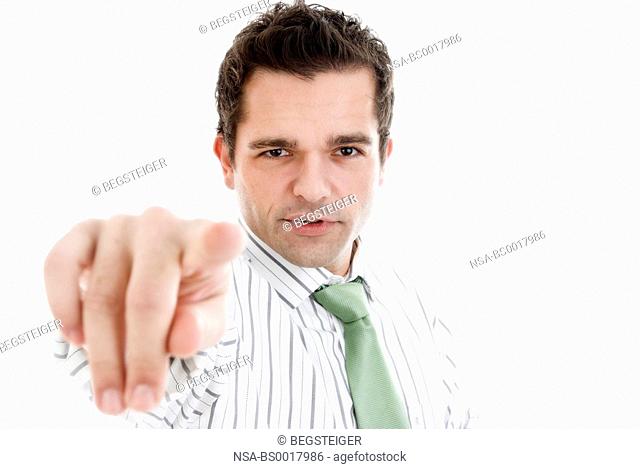 young businessman points a finger