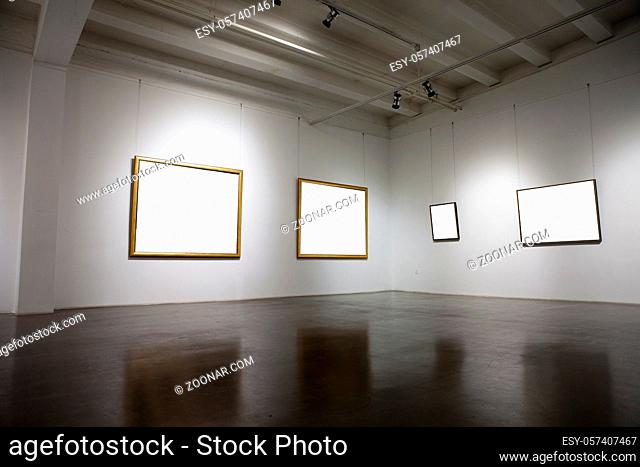 A blank picture frame in the exhibition room high quality photo