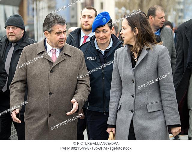 German Foreign Minister Sigmar Gabriel (L, SPD) walks next to Nataliya Apostolova, European Union Special Representative in Kosovo