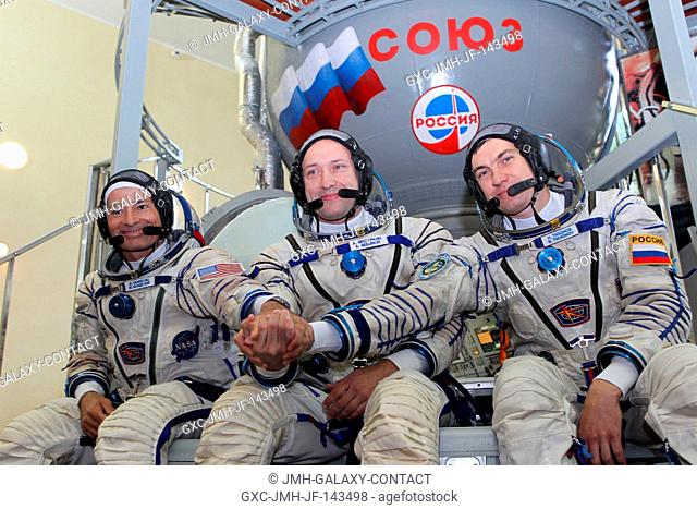 At the Gagarin Cosmonaut Training Center in Star City, Russia, Expedition 49-50 backup crewmembers Mark Vande Hei of NASA (left) and Alexander Misurkin (center)...