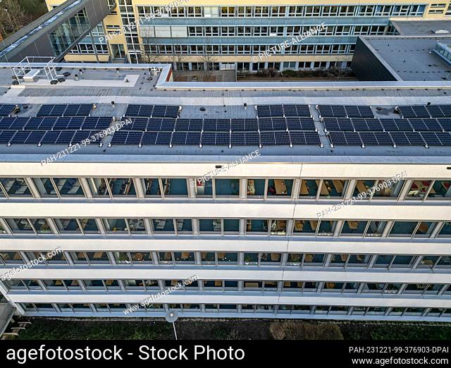 PRODUCTION - 16 December 2023, Saxony, Leipzig: A solar system is installed on the roof of a school in Leipzig. The number of photovoltaic systems installed on...