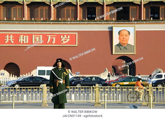 China, Beijing, Tiananmen Square, Policeman in winter clothes across from the Gate of Heavenly Peace, entrance to the Forbidden City