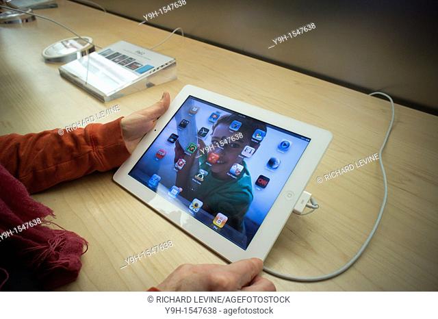 Hordes of shoppers descend on the Apple Store on Fifth Avenue in New York to buy and try out the new iPad 2  The store sold out its daily allotment of the...