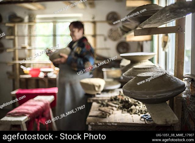 Woman making Horezu ceramics, a unique type of Romanian pottery, UNESCO Cultural Heritage List, Wallachia, Romania