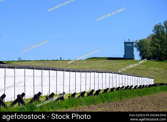 PRODUCTION - 09 May 2022, Saxony-Anhalt, Hötensleben: The former tower of the command post above the old border wall and the motor vehicle humps