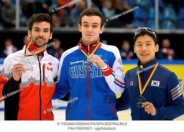 Russia's Dmitry Migunov (C) won ahead of Canada's Francois Hamelin (L), and South Korea's Yoon-Gy Kwak in the 500m at the Short Track World Cup in the...