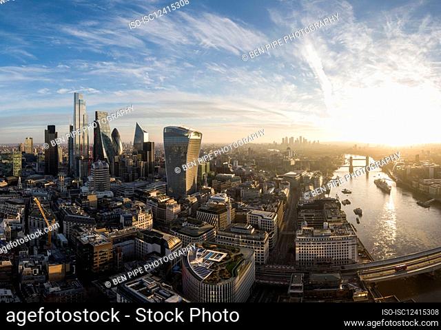 UK, London, Aerial view of financial district skyscrapers at sunset
