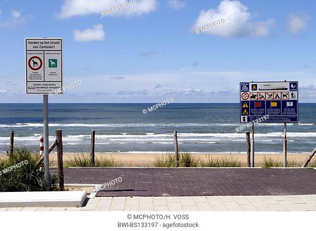 view on the beach and the sea from the beach promenade with information signs in Zandvoort, Netherlands