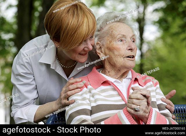 Germany, North Rhine Westphalia, Cologne, Senior woman and mature woman in park