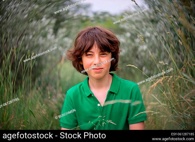 Portrait of a boy on the background of nature