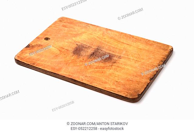 Old wooden cutting board isolated on white