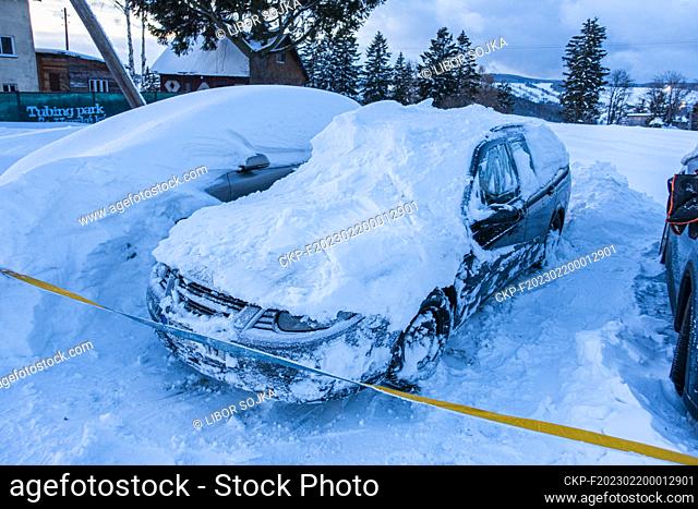 snow covered cars, dug out car Saab 95, parking lot, snowdrift, winter, snow, Benecko, Liberec Region, Czech Republic, on February 2, 2023