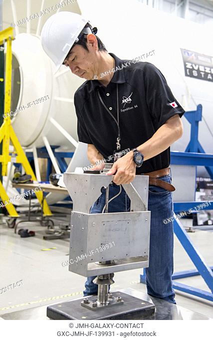 Japan Aerospace Exploration Agency (JAXA) astronaut Kimiya Yui, Expedition 4445 flight engineer, participates in an extravehicular activity (EVA) hardware...
