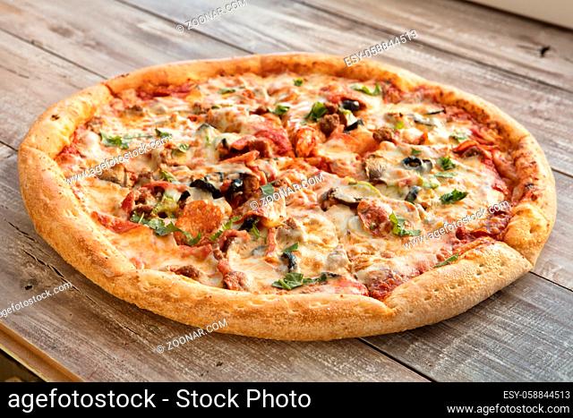 Pizza on an old wooden table