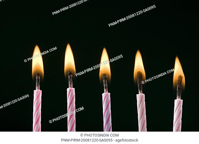 Close-up of burning birthday candles
