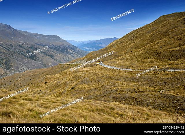 Scenic viewpoint of road, mountains, and lake in south island of New Zealand
