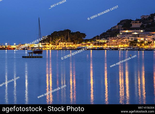 Harbor and beach of Port de la Selva, illuminated at night in the blue hour (Alt Empordá , Girona, Catalonia, Spain)