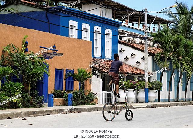 Man riding a curious bicycle, Playa El Tirano, Isla de Margarita, Nueva Esparta, Venezuela