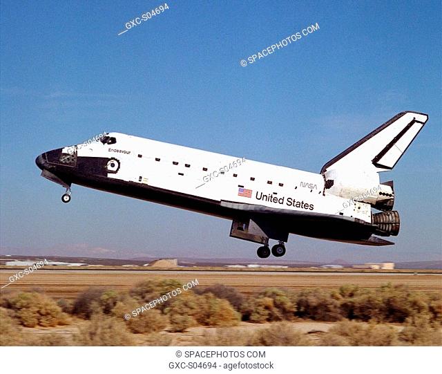 The shuttle Endeavour comes in for a landing on runway 22 at Edwards, California, to complete the highly successful STS-68 mission dedicated to radar imaging of...