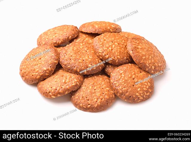 Pile of sesame seeds cookies isolated on white