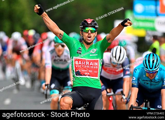 Italian Sonny Colbrelli of Bahrain Victorious celebrates as he crosses the finish line to win the third stage of the 73rd edition of the Criterium du Dauphine...