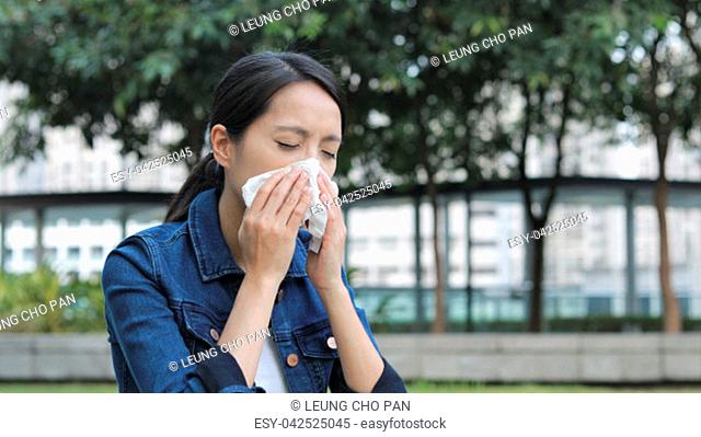 Woman feeling sick and wearing mask