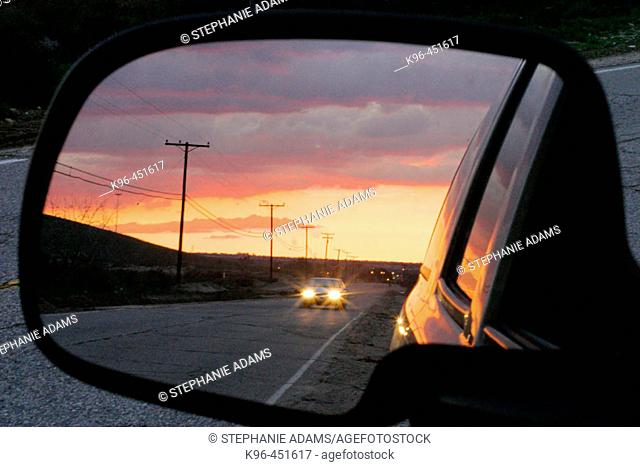 sunset reflection in car mirror