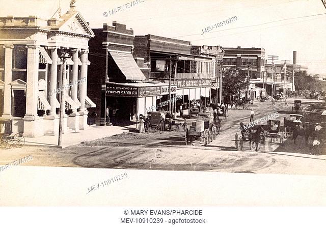 Street in San Angelo, Texas, USA, showing Concho Saddles, the Daily Standard, the Wylie Hardware Co, and the First National Bank
