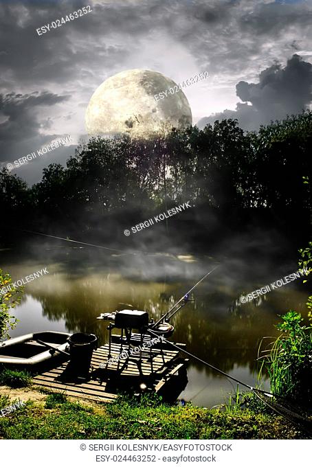 Full moon over fishing pier on river. Elements of this image furnished by NASA