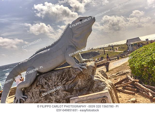 Large statue in the shape of an Iguana at Isla Mujeres in Mexico