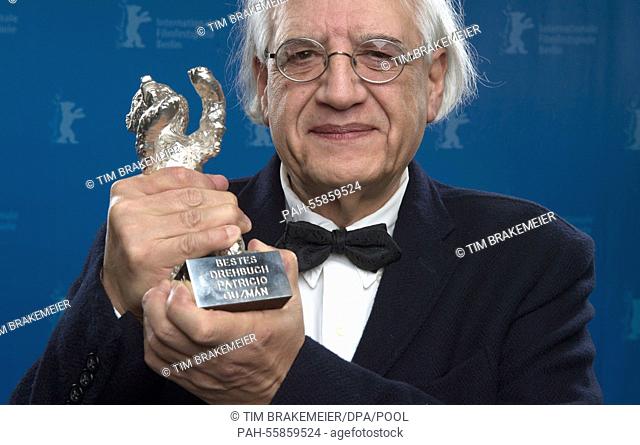 Patricio Guzman holds up Silver Bear for Best Script, which he won for the film 'El boton de nacar, ' at the 65th International Film Festival in Berlin