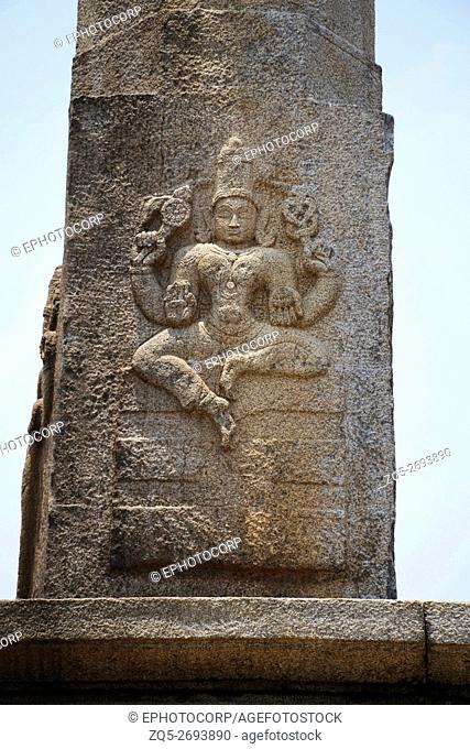Carved figures of seated Kushmandini on the north side of the Manasthambha (Pillar) in front of Parsvanatha basadi or basti, Chandragiri hill, Sravanabelgola