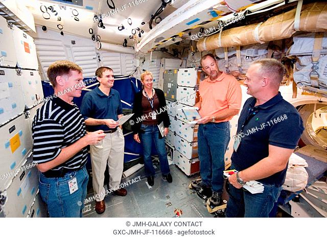 NASA astronauts Chris Ferguson (left), STS-135 commander; Rex Walheim, Sandy Magnus, both mission specialists; and Doug Hurley (right foreground), pilot