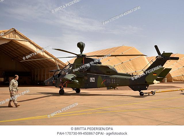 A Tiger attack helicopter is brought out of its hangar onto the airfield at Camp Castor in Gao, Mali, 30 July 2017. Photo: Britta Pedersen/dpa