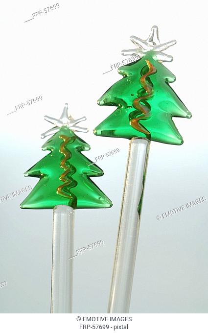 Green Christmas trees on a glass stick